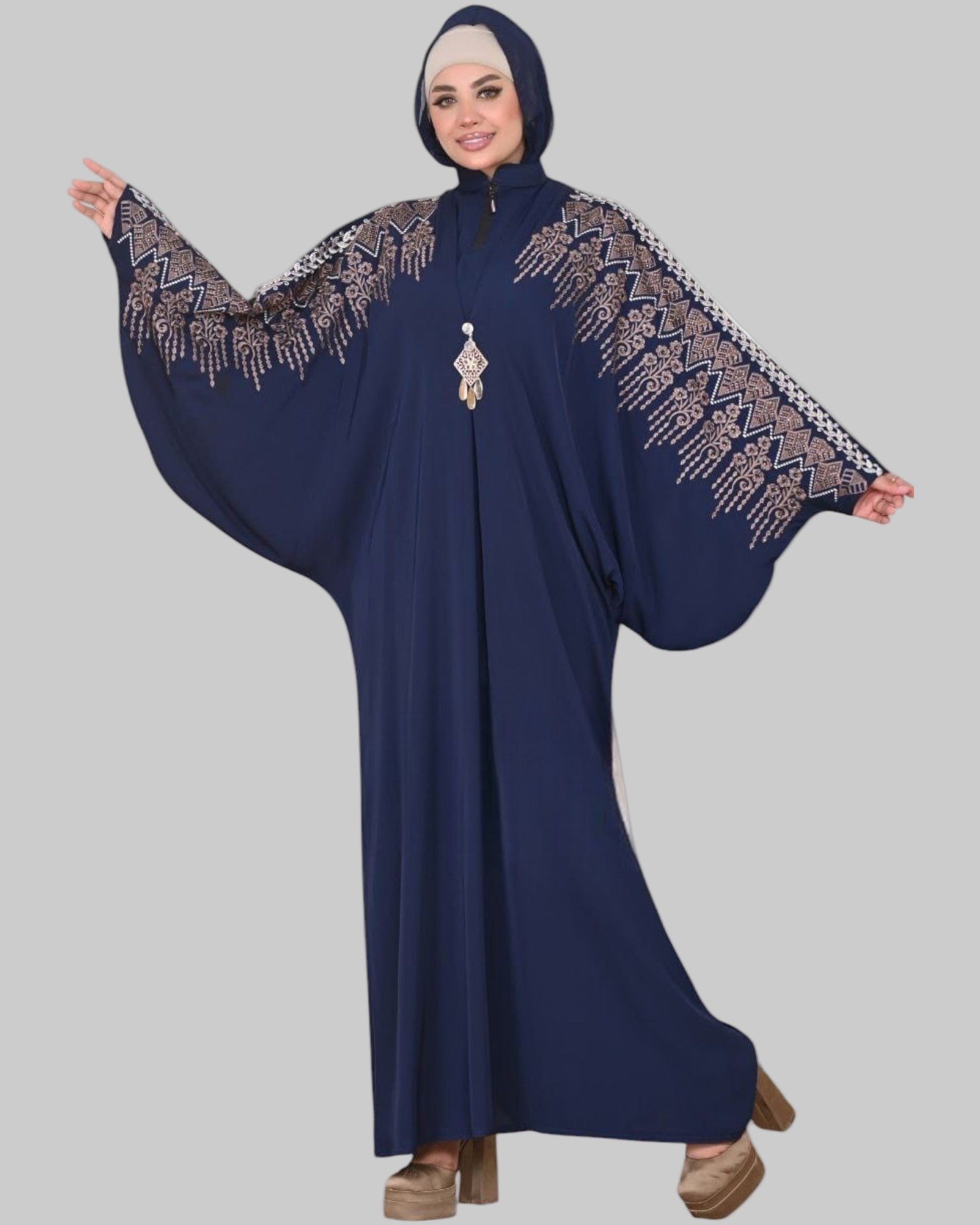 Ruqayya navy blue batwing abaya with intricate gold embroidery on the shoulders and sleeves for modest Islamic fashion.
